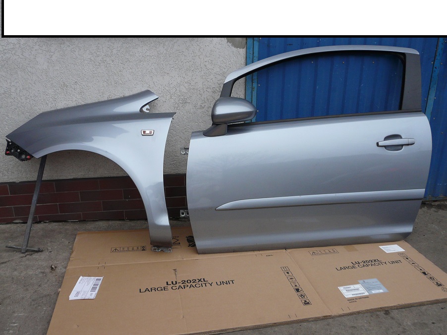 OPEL CORSA D  BŁOTNIK LEWY PRZÓD Z163